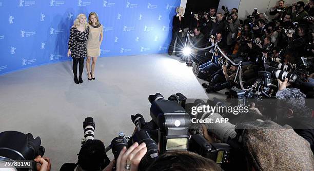 Actresses Scarlett Johansson and Natalie Portman pose for photographers during a photocall for the movie "The Other Boleyn girl" by British director...