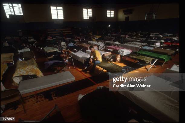 People lie on cots in a shelter September 27, 1989 in South Carolina. Hugo is ranked as the eleventh most intense hurricane to strike the US this...