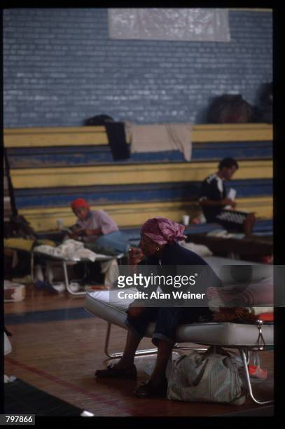 People sit on cots in a shelter September 27, 1989 in South Carolina. Hugo is ranked as the eleventh most intense hurricane to strike the US this...