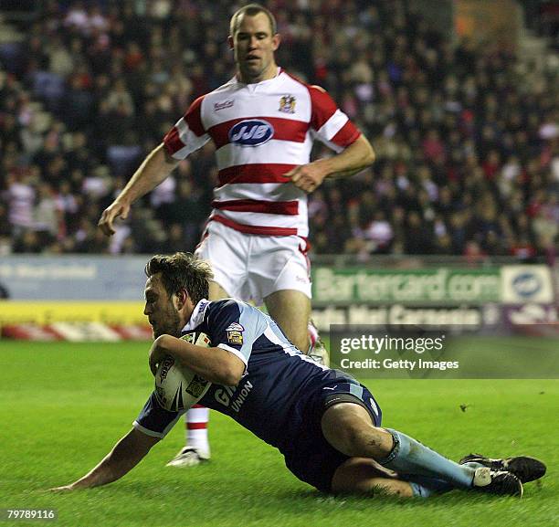 Castleford's Peter Lupton slides into score during the Wigan Warriors v Castleford Tigers Engage Super League match played at JJB Stadium on February...