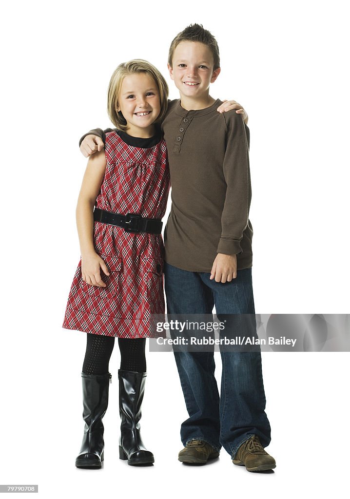 Boy and girl embracing and smiling