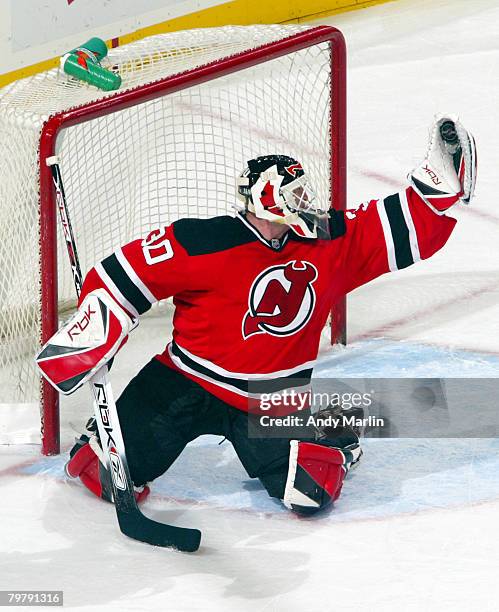 Martin Brodeur of the New Jersey Devils makes a glove save against the Atlanta Thrashers during their game at the Prudential Center on February 15,...