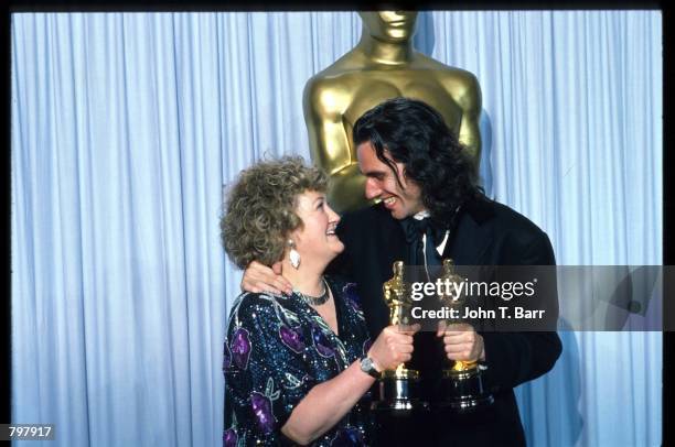 Brenda Fricker and Daniel Day-Lewis hug backstage during the 62nd Academy Awards ceremony March 26, 1990 in Los Angeles, CA. They received Oscars for...