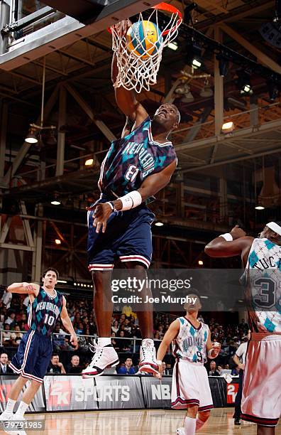 Terrell Owens, NFL player, dunks during the McDonald's NBA All-Star Celebrity Game on center court during NBA Jam Session Presented by Adidas on...