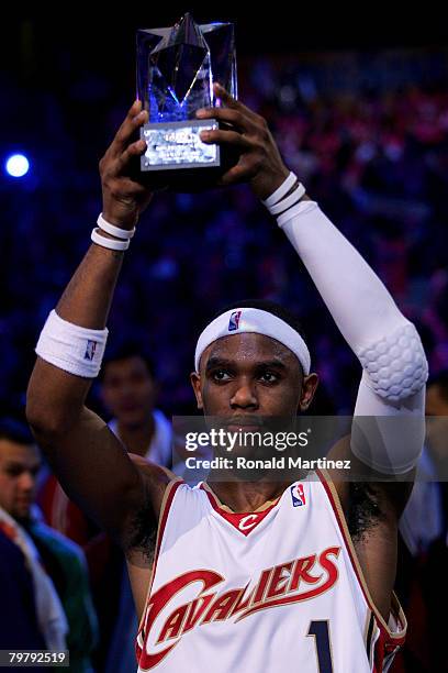 Daniel Gibson of the Sophomore holds up the MVP trophy following the Sophomores' win over the Rookies during the T-Mobile Rookie Challenge & Youth...