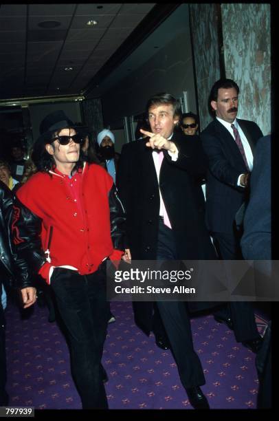 Entertainer Michael Jackson and real estate mogul Donald Trump attend the opening of the Taj Mahal hotel and casino April 5, 1990 in Atlantic City,...