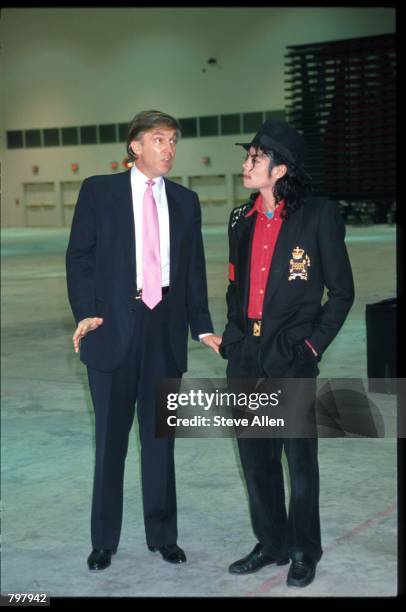 Entertainer Michael Jackson and real estate mogul Donald Trump attend the opening of the Taj Mahal hotel and casino April 5, 1990 in Atlantic City,...