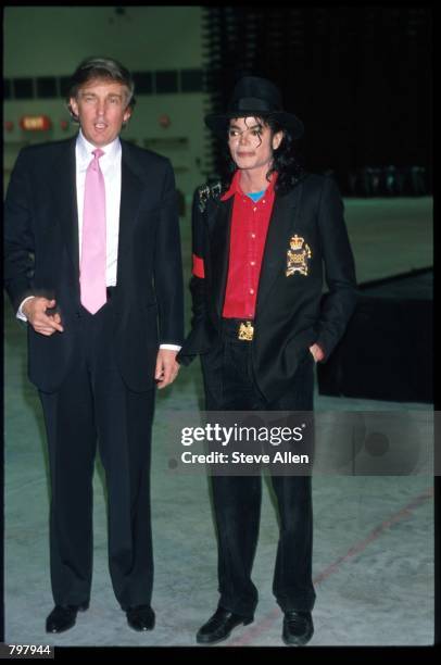 Entertainer Michael Jackson and real estate mogul Donald Trump attend the opening of the Taj Mahal hotel and casino April 5, 1990 in Atlantic City,...