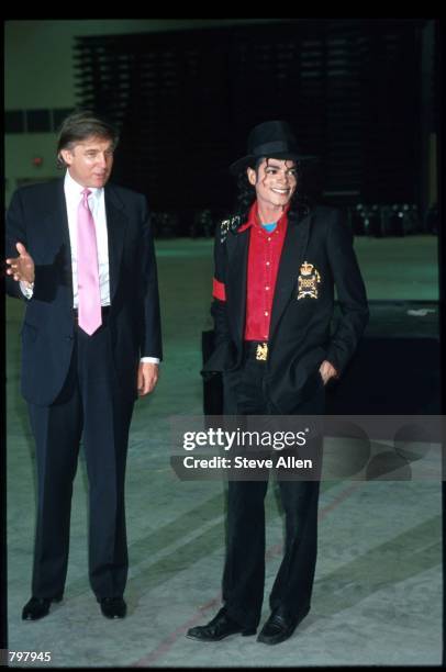 Entertainer Michael Jackson and real estate mogul Donald Trump attend the opening of the Taj Mahal hotel and casino April 5, 1990 in Atlantic City,...