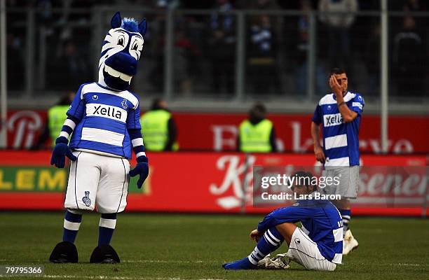 Blagoy Georgiev of Duisburg looks dejected next to maskot "Enartz" after loosing the Bundesliga match between MSV Duisburg and VfB Stuttgart at the...