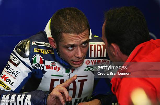 Valentino Rossi of Italy and Fiat Yamaha talks to a team engineer during MotoGP Testing at the Circuito de Jerez, on February 16, 2008 in Jerez,...