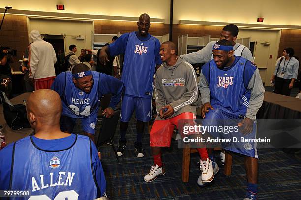LeBron James of the East All-Stars and Chris Paul of the West All-Stars laugh prior to the East All-Stars Practice on center court at NBA Jam Session...