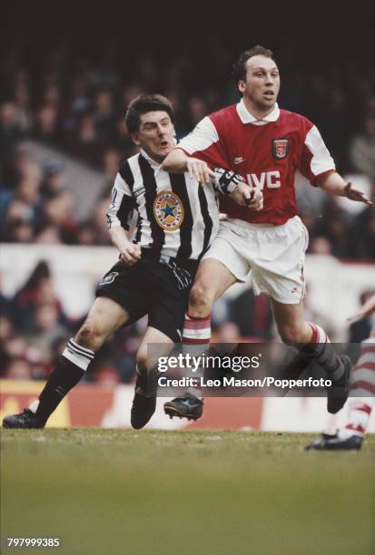 Peter Beardsley of Newcastle and David Platt of Arsenal clash for the ball during the Premier League match between Arsenal and Newcastle United at...