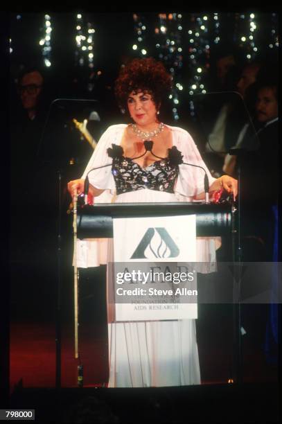 Activist Elizabeth Taylor speaks at a gala fundraiser on World AIDS Day November 13, 1990 in New York City. World AIDS Day was created in an effort...