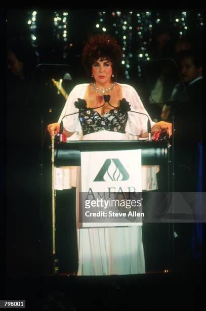 Activist Elizabeth Taylor speaks at a gala fundraiser on World AIDS Day November 13, 1990 in New York City. World AIDS Day was created in an effort...