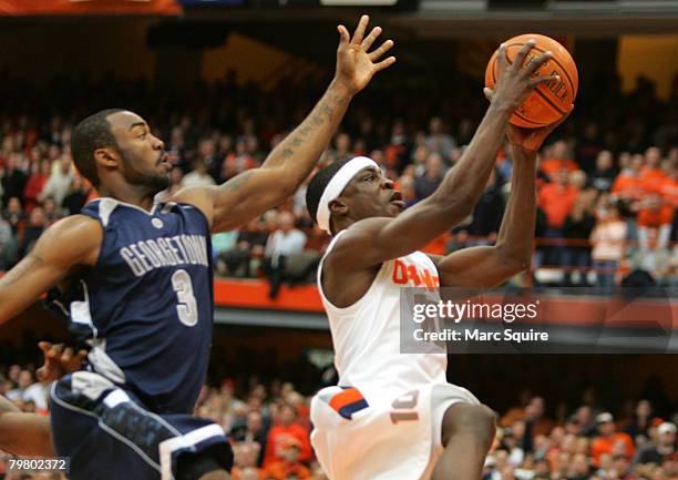 Guard Jonny Flynn of the Syracuse Orange drives past Forward Dajuan Summers of the Georgetown Hoyas during the game at the Carrier Dome February 16,...