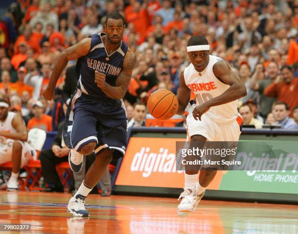 Guard Jonny Flynn of the Syracuse Orange drives past Forward Dajuan Summers of the Georgetown Hoyas during the game at the Carrier Dome February 16,...