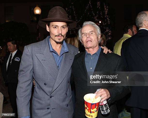 Actor Johnny Depp and producer Richard D. Zanuck arrive at the special screening for DreamWorks Pictures' 'Sweeney Todd' held at the Paramount...