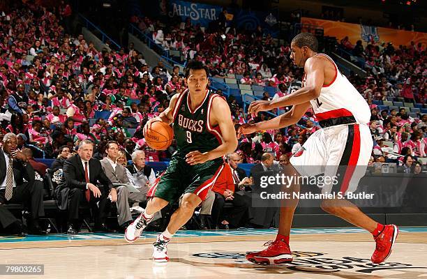 Yi Jianlian of the Rookie team drives against LaMarcus Aldridge of the Sophomore team during the T-Mobile Rookie Challenge & Youth Jam part of 2008...