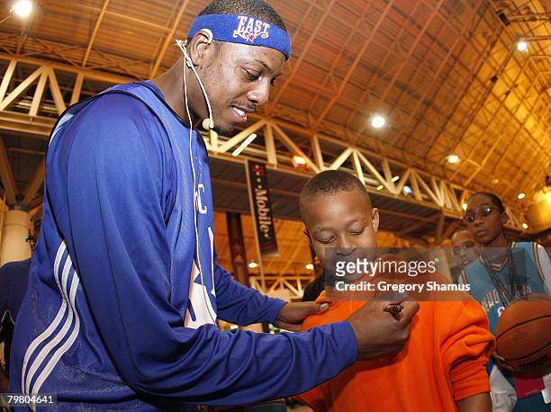 Paul Pierce of the Boston Celtics signs autographs after a clinic at the T-Mobile "Live Like Your Faves" area at Jam Session presented by Adidas...