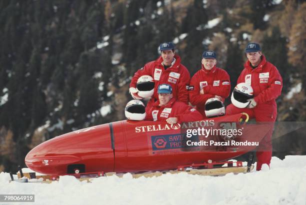 Edd Horler, Nick Phipps, Mark Tout and Dave Armstrong of the British Four man Bobsleigh team pose for a team picture with their sled on 1 January...