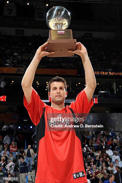 Jason Kapono of the Miami Heat holds up the trophy after winning the Foot Locker Three-Point Shootout part of 2008 NBA All-Star Weekend at the New...