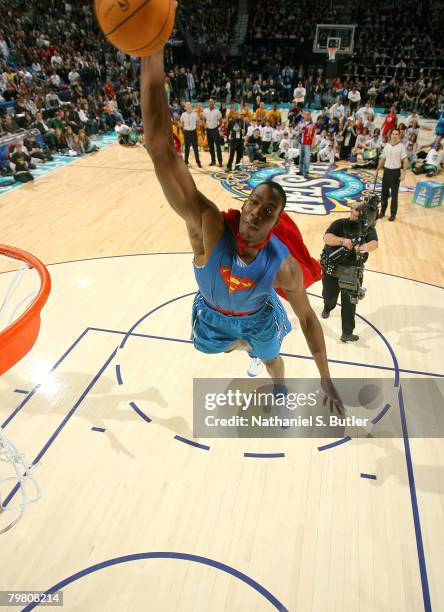 Dwight Howard of the Orlando Magic completes his SUperman dunk during the Sprite Slam Dunk Contest part of 2008 NBA All-Star Weekend at the New...