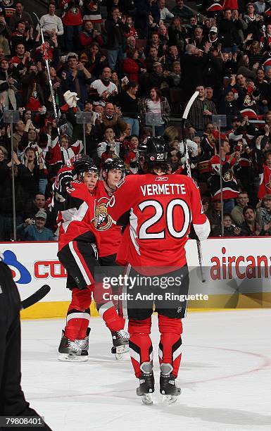 Chris Kelly of the Ottawa Senators celebrates his third period goal against the New Jersey Devils with teammates Antoine Vermette and Christoph...