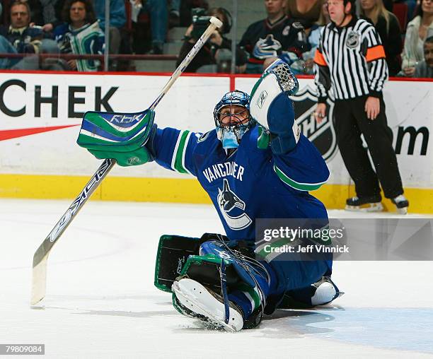 Roberto Luongo of the Vancouver Canucks makes a glove save off an Edmonton Oiler shot during their game at General Motors Place on February 16, 2008...