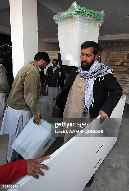 Pakistani election officials carry election material after its distribution in Islamabad, on February 17, 2008. Pakistan will hold on 18 February the...