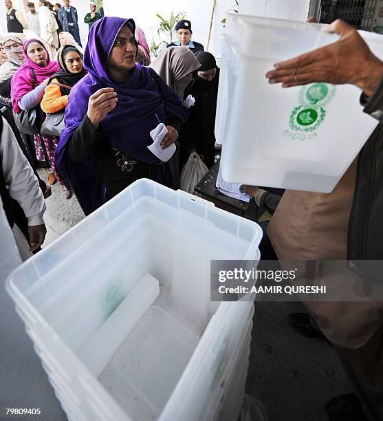 Pakistani female election officials wait to receive election material at as distribution centre in Islamabad on February 17, 2008. Pakistan will hold...