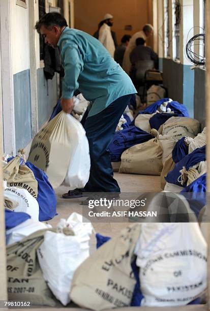 Pakistani election officials distrubute election material at a distribution centre in Karachi on February 17, 2008. Pakistan will hold on February...