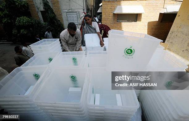 Pakistani election officials load ballot boxes onto a truck at a distribution centre in Karachi on February 17, 2008. Pakistan will hold on February...