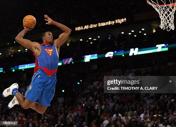 Dwight Howard of the Orlando Magic jumps wearing a Superman Cape in the Sprite Slam-Dunk Contest at the New Orleans Arena during the 2008 NBA...