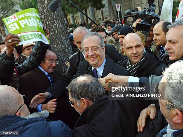 Italian centre-left Democratic Party leader Walter Veltroni shakes hands with citizens in Pescara's central square on February 17 at the start of his...