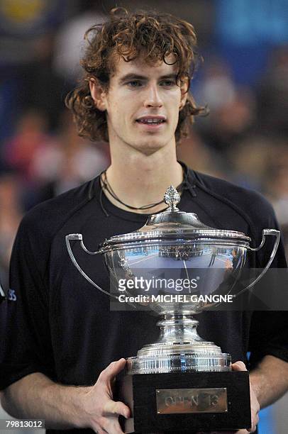 British fourth seed Andy Murray celebrates with his trophy after winning over Croatian Mario Ancic 6-3, 6-4, on February 17, 2008 during their final...
