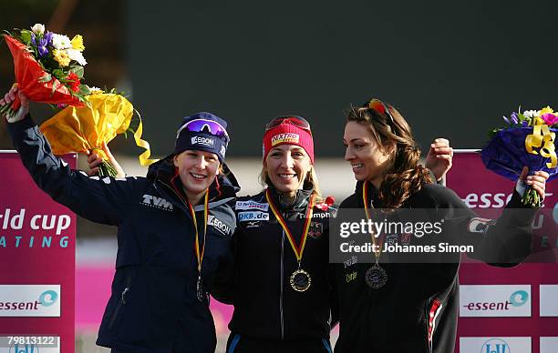 Ireen Wuest of the Netherlands, Anni Friesinger of Germany and Shannon Rempel of Canada celebrate after the 1000m heats during Day 2 of the Essent...