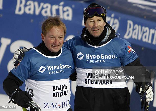 Former ski stars Slovenian's Bojan Krizaj and Sweden's Ingemar Stenmark smile after finishing a charity race for hospital in Gornja Bistra, some 50...