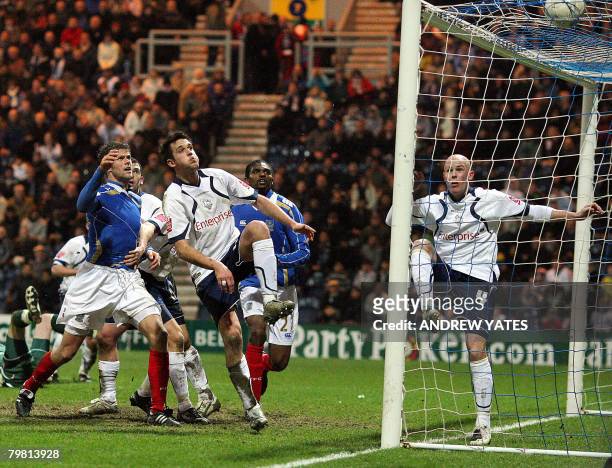 Preston's Darren Carter scores an own goal during an FA Cup fifth round football match against Portsmouth at Deepdale, in northwest England on...