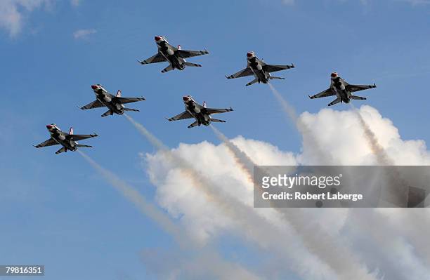 The U.S. Air Force Thunderbirds fly overhead during pre-race ceremonies for the NASCAR Sprint Cup Series Daytona 500 at Daytona International...