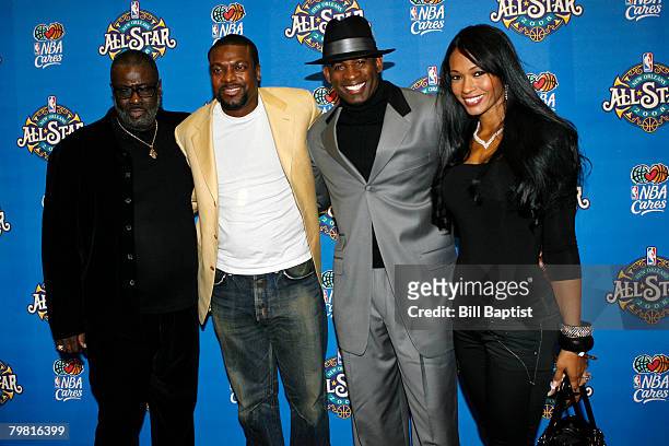 Actor Chris Tucker , former NFL player Deion Sanders and his wife pose for a portrait on the red carpet prior to the 2008 NBA All-Star Game at the...