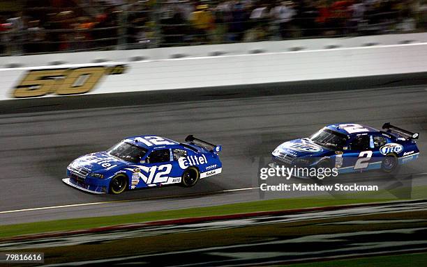 Ryan Newman, driver of the Alltel Dodge, leads Kurt Busch, driver of the Miller Lite Dodge, during the last lap of the NASCAR Sprint Cup Series...