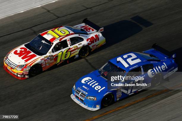 Greg Biffle, driver of the 3M Ford, races against Ryan Newman, driver of the Alltel Dodge, during the NASCAR Sprint Cup Series Daytona 500 at Daytona...