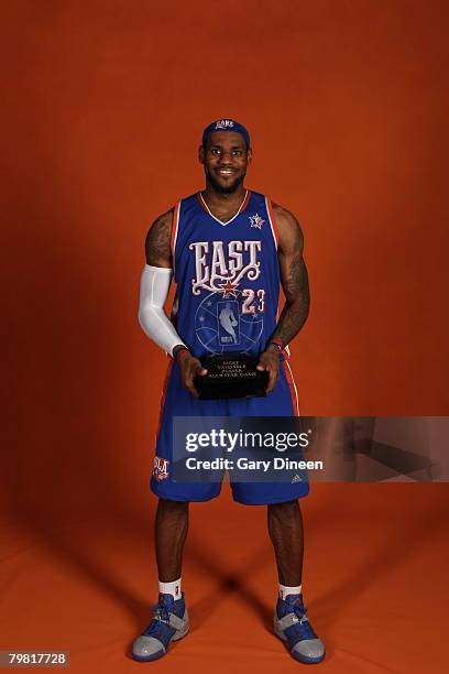 LeBron James of the Eastern Conference All-Stars poses with the MVP trophy after the 2008 All-Star Game at the New Orleans Arena February 17, 2008 in...
