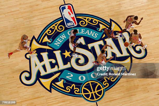 Members of the Eastern Conference and the Western Conference All-Star teams run across mid-court during the 57th NBA All-Star Game, part of 2008 NBA...