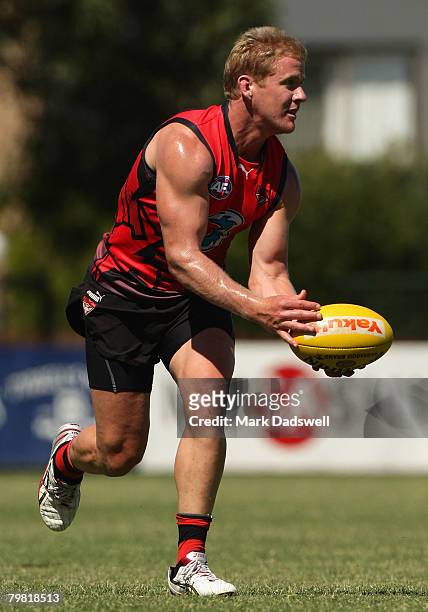 Jason Johnson of the Bombers gathers the ball during an Essendon Football Club training session held at Windy Hill February 18, 2008 in Melbourne,...