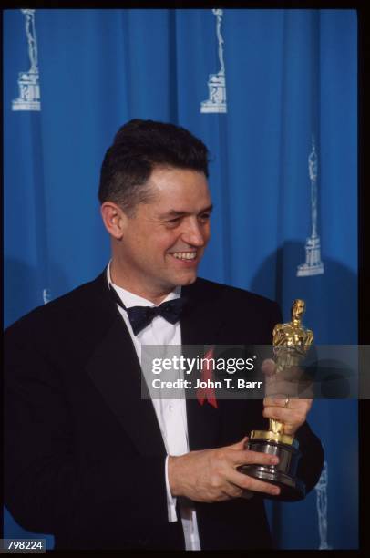 Best Director recipient Jonathan Demme holds his oscar at the 64th annual Academy Awards March 30, 1992 in Los Angeles, CA. The Academy of Motion...