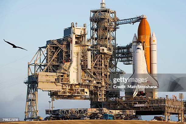 The shuttle crawler-transporter rolls out of position after positioning Space Shuttle Endeavour on launch pad 39-A at Kennedy Space Center on...