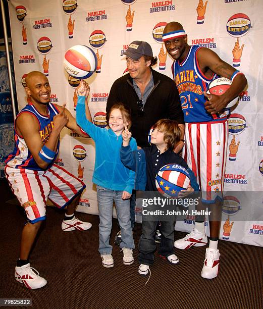 Jamison Belushi gets a little help with ball spinning from Scooter Christensen and Special K Daley with her dad, Jim Belushi and her little brother...