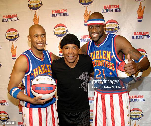 Sugar Ray Leonard poses for pictures backstage during halftime with Scooter Christensen and Special K Daley at the Los Angeles premiere of the Harlem...